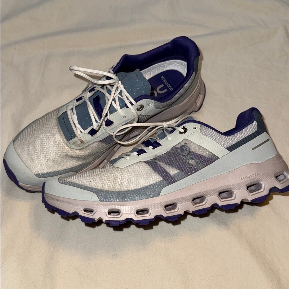 On Running White and Purple Sneakers